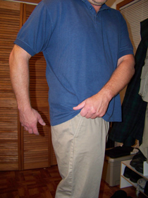 lifting a shirt to reach the hem and access concealed gun